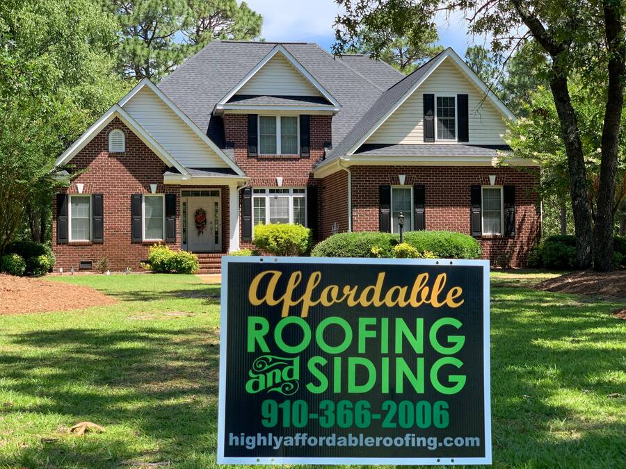 Large brick colonial with new gray shingles β Eastern NC